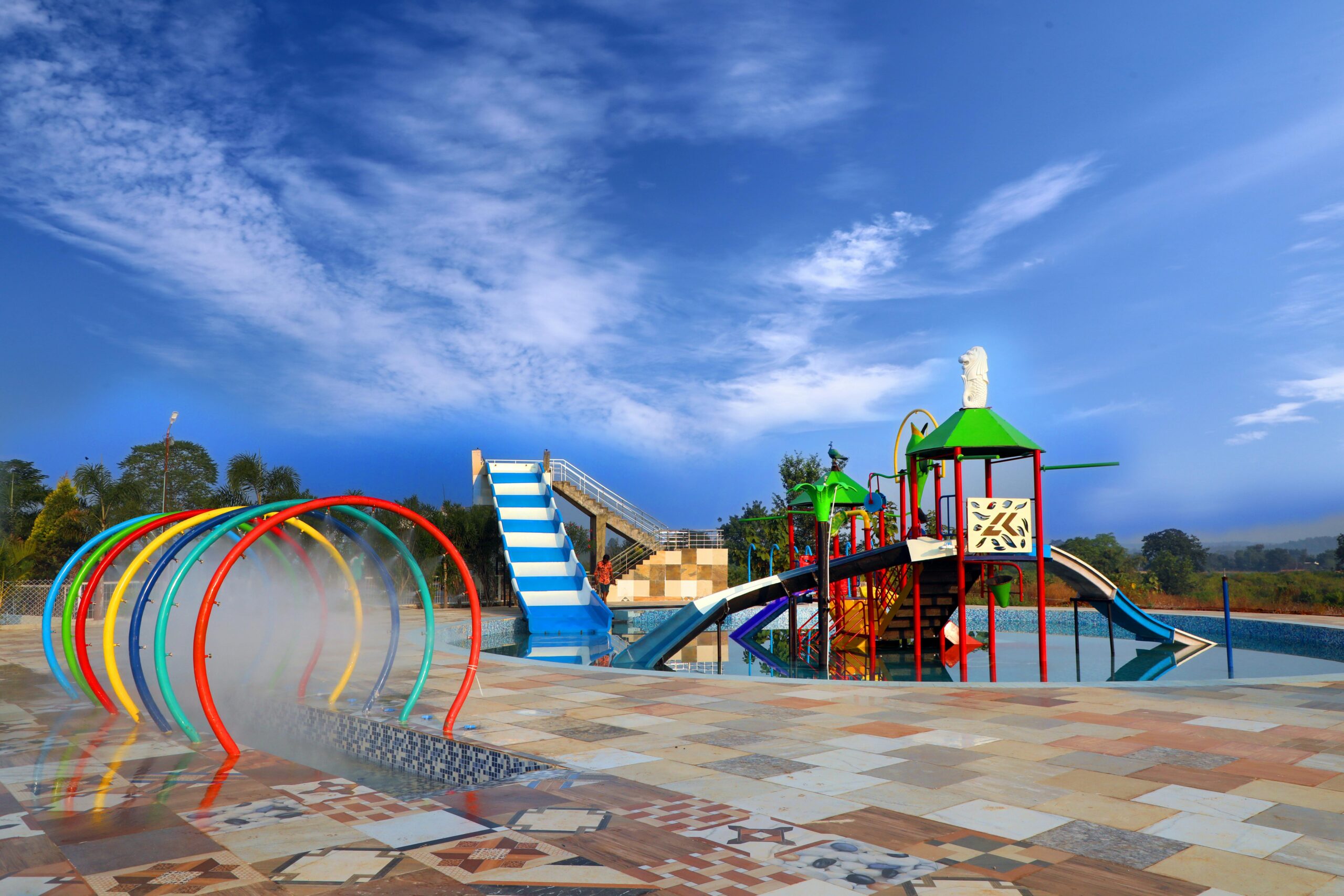 Things to Do in Raleigh with Kids at a Colorful outdoor water playground with slides, and spray tunnels
