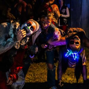 Three people dressed up in costume for the haunted trail
