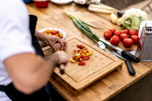 Man cutting on cutting board