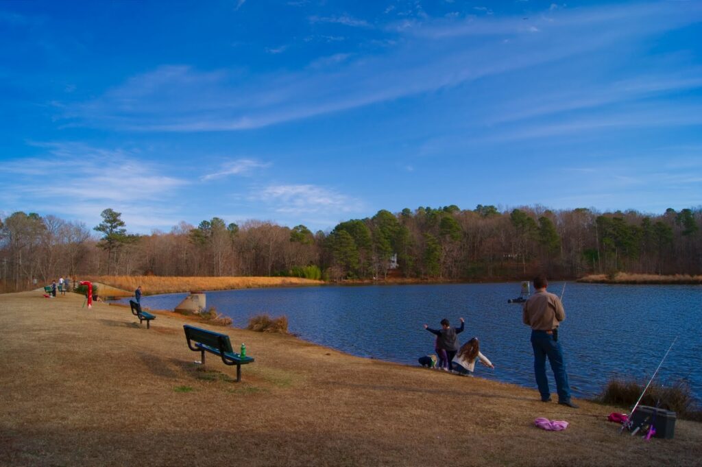 Fishing at Bass Lake Park, a Holly Springs favorite in the Fuquay-Varina vs Holly Springs debate